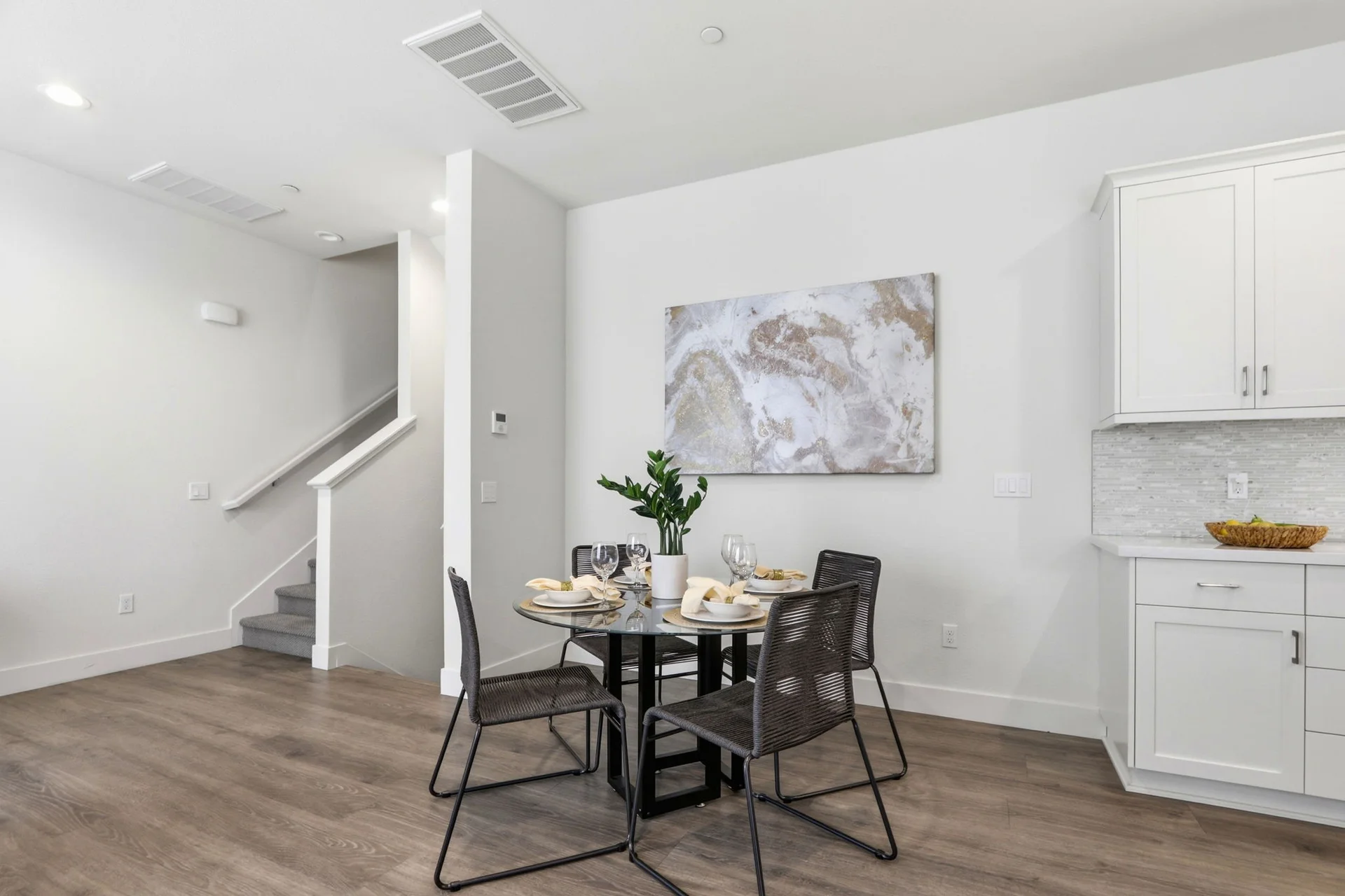 Dining nook beside the kitchen cabinets at the stair